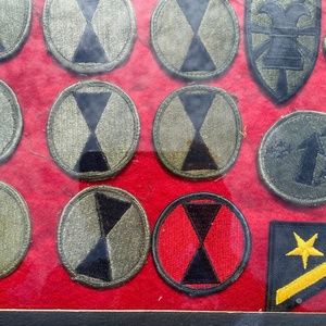 Vintage tray of military patches.